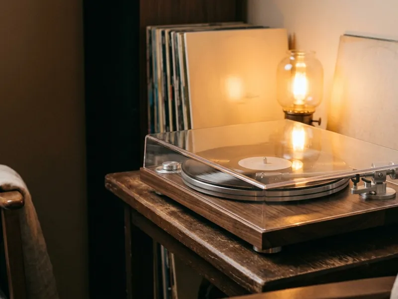 Compact turntable with dust cover in a cozy corner